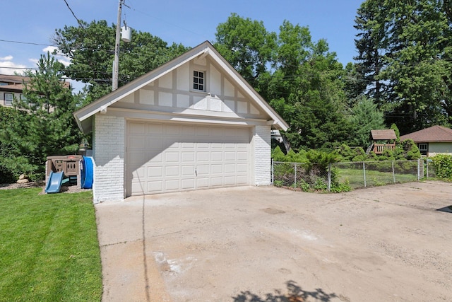 garage featuring a yard