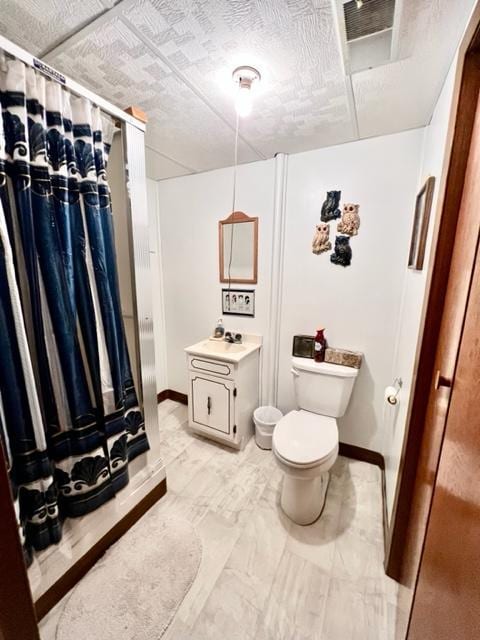 bathroom with vanity, toilet, and a shower with shower curtain