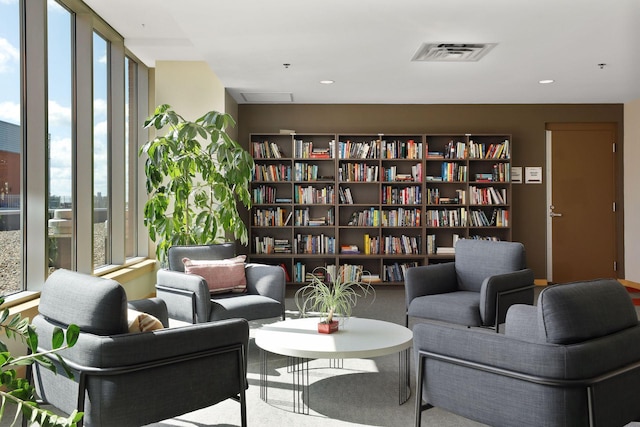 living area with expansive windows and visible vents