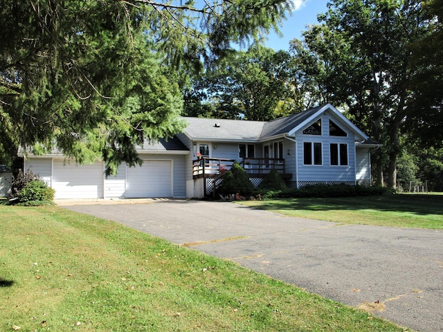 ranch-style house with a front yard and a garage