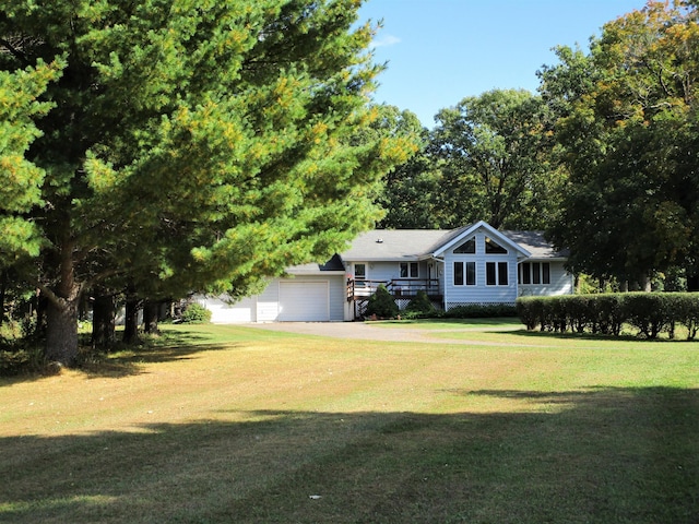 view of front facade featuring a front yard and a garage