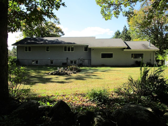 back of house with a yard