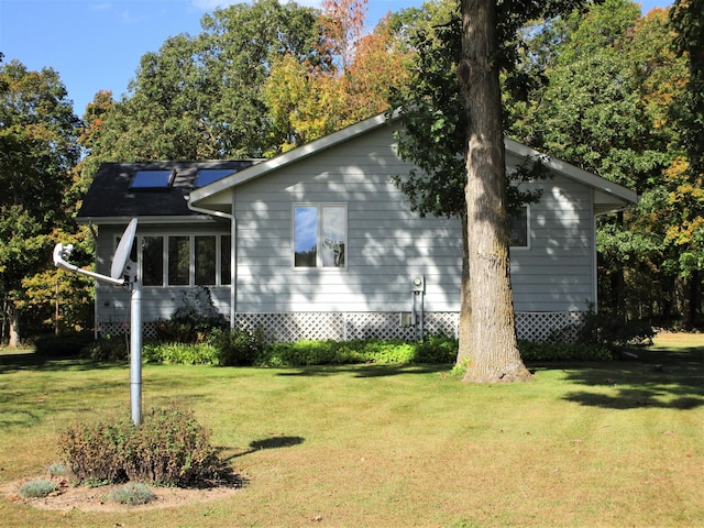 view of home's exterior featuring a yard