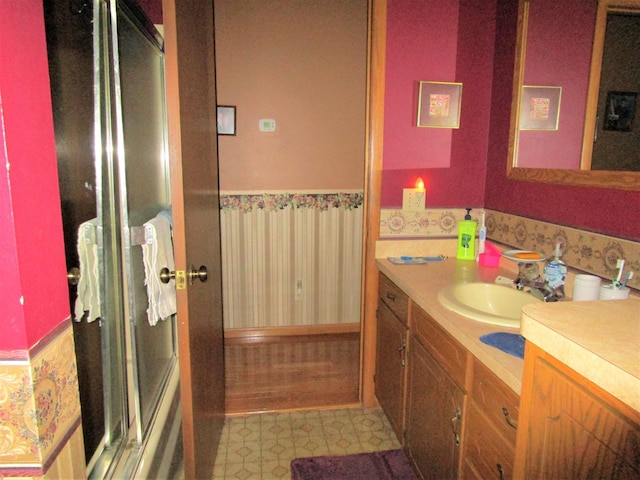 bathroom with vanity and walk in shower