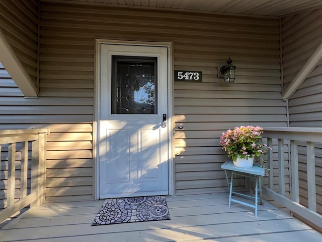 doorway to property with a porch