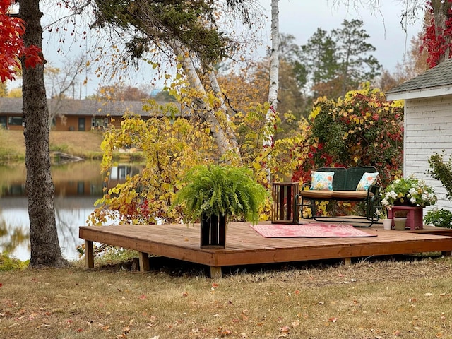 wooden deck featuring a water view