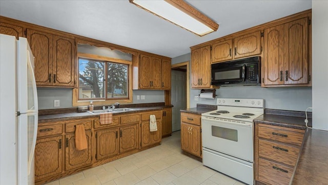 kitchen with white appliances and sink