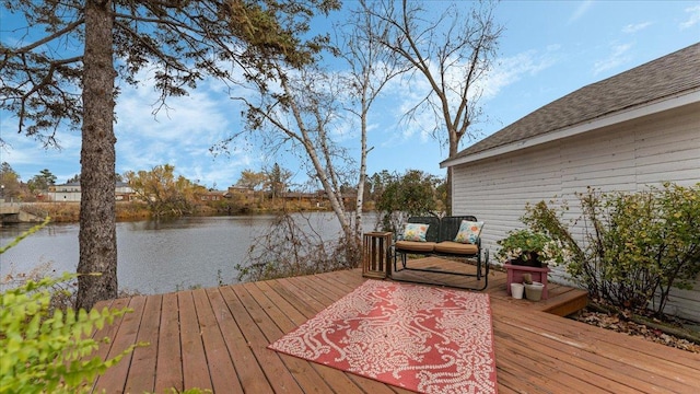 wooden deck with a water view