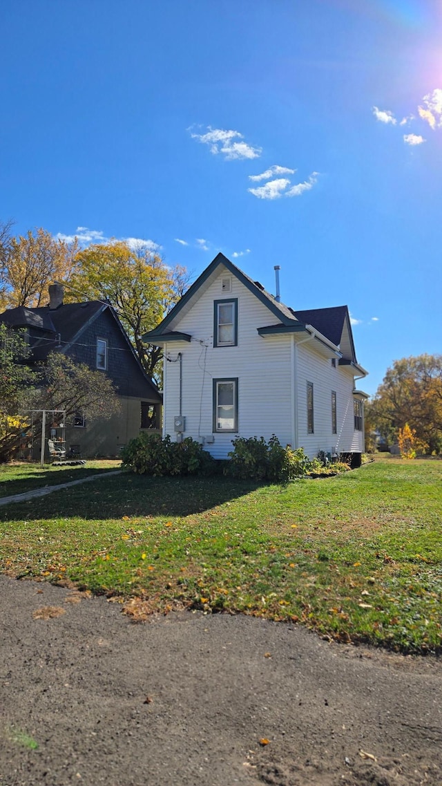 view of property exterior featuring a yard