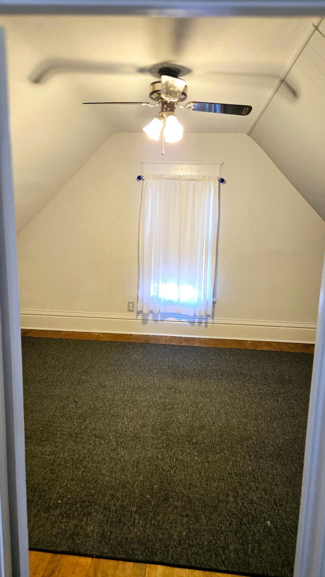 bonus room with ceiling fan, carpet flooring, and lofted ceiling