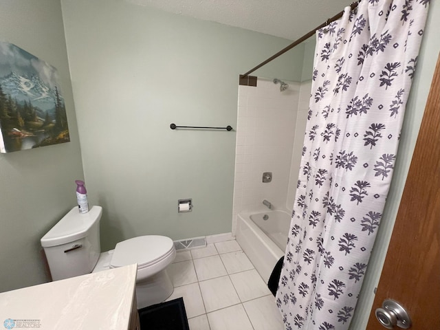 full bathroom featuring shower / bath combo, vanity, a textured ceiling, tile patterned flooring, and toilet