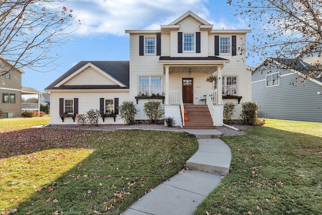 view of front of property featuring a front yard and covered porch