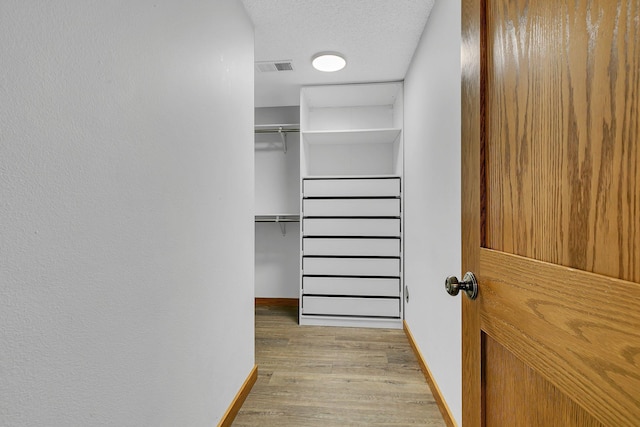2008 11th St N, Sartell, MN 56377 - spacious closet featuring wood finished floors