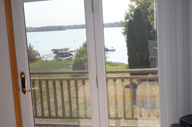 doorway to outside with a water view