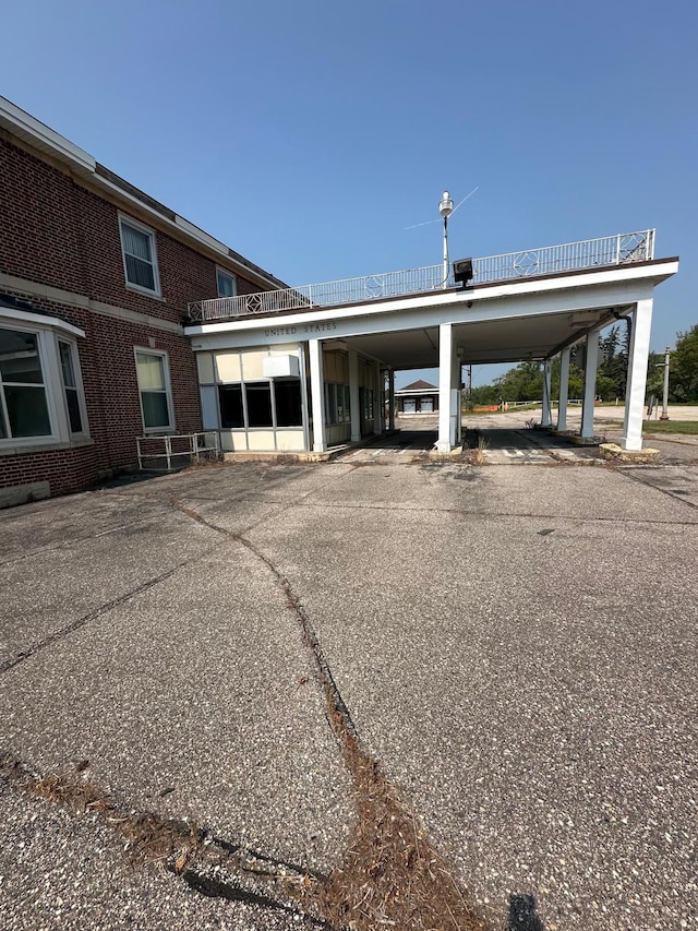 view of vehicle parking with a carport