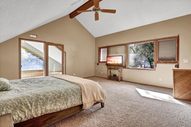 bedroom with ceiling fan, vaulted ceiling with beams, a textured ceiling, and carpet