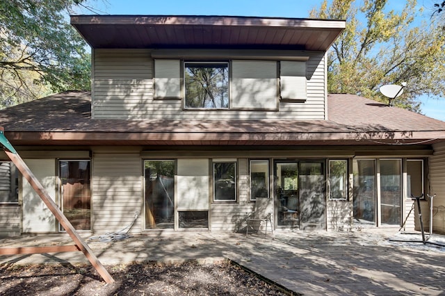 rear view of house featuring a patio