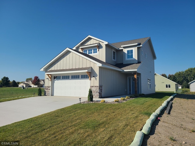 craftsman inspired home featuring a front lawn and a garage