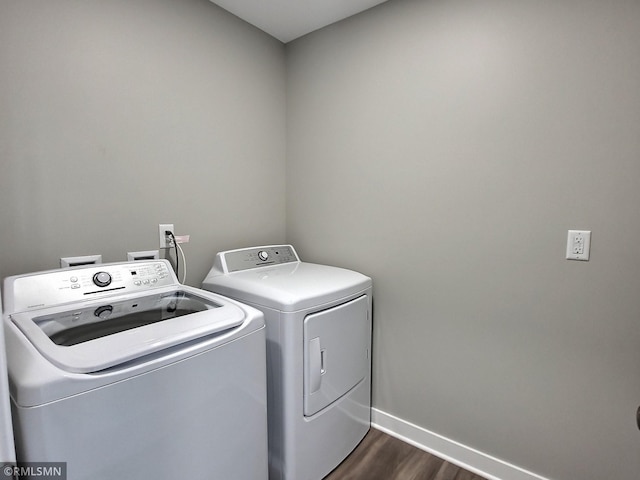 65164 365th St, Watkins, MN 55389 - washroom with laundry area, independent washer and dryer, dark wood-type flooring, and baseboards