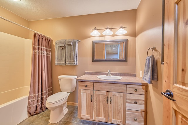 full bathroom with vanity, shower / bath combo with shower curtain, toilet, and a textured ceiling