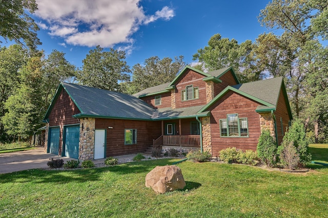 view of front facade featuring a front lawn, covered porch, and a garage