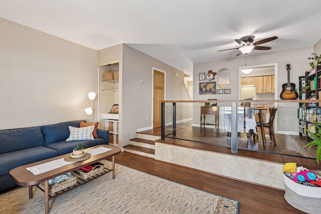 living room with ceiling fan and hardwood / wood-style floors