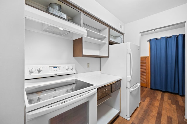 kitchen with ventilation hood, white appliances, and dark hardwood / wood-style floors