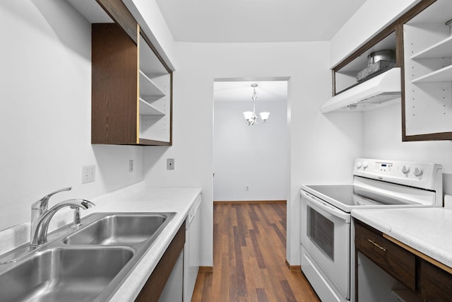 kitchen featuring white appliances, ventilation hood, dark wood-type flooring, sink, and decorative light fixtures