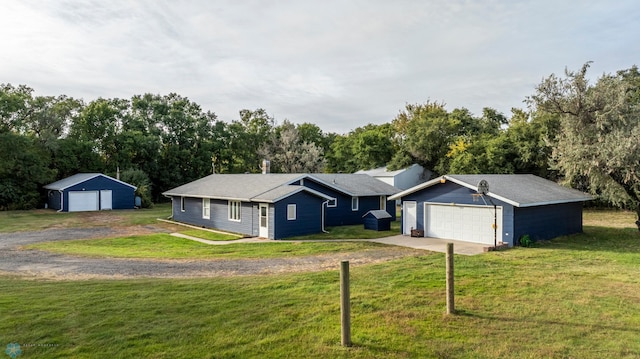 ranch-style home with a garage and a front yard