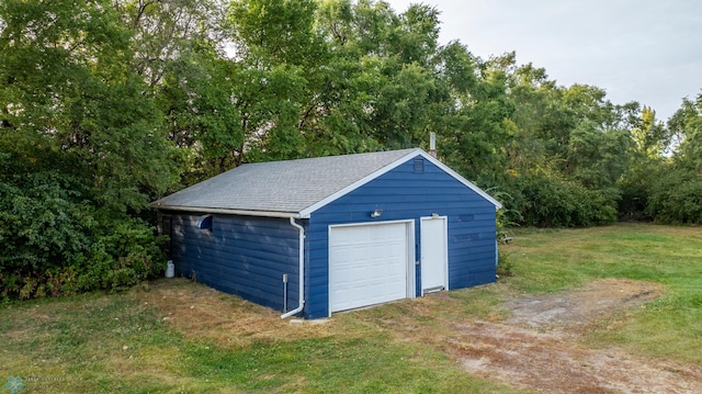 garage with a lawn