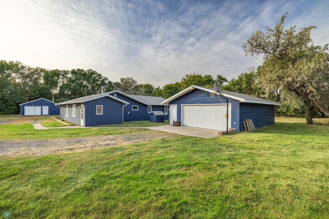 view of front facade with a front lawn and an outbuilding