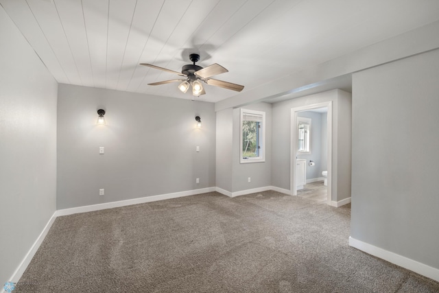 empty room with carpet and ceiling fan