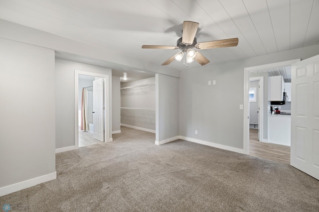 interior space featuring ceiling fan