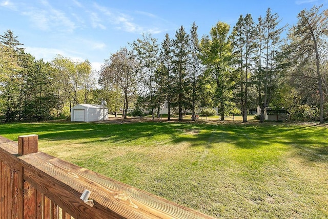 view of yard with an outbuilding and a garage