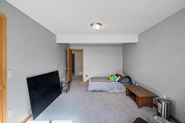 bedroom featuring carpet floors and baseboards