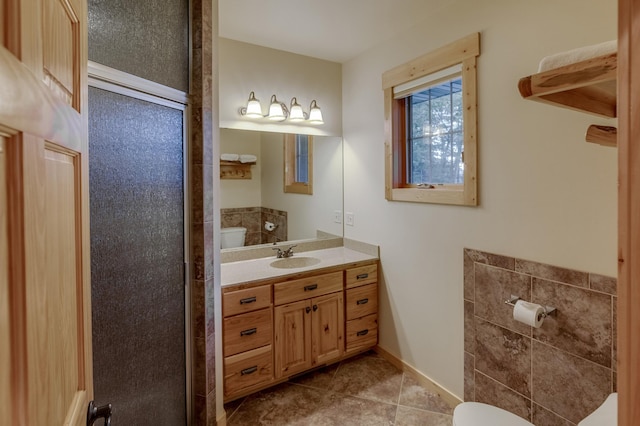 bathroom with vanity, toilet, and tile patterned floors