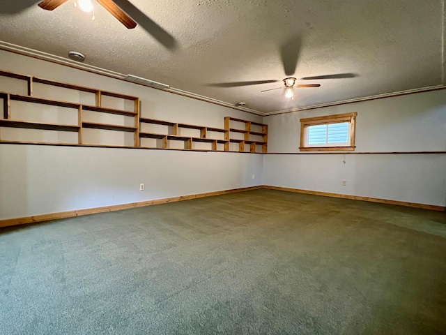 spare room featuring ceiling fan, a textured ceiling, crown molding, and carpet flooring