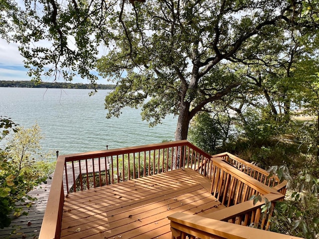 wooden deck with a water view