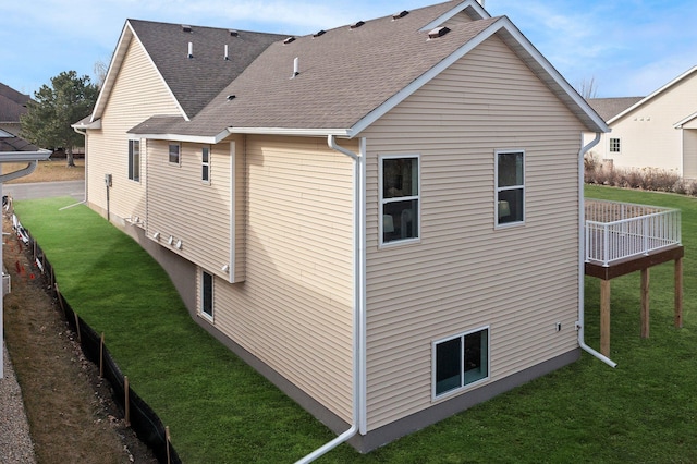 view of property exterior with a yard