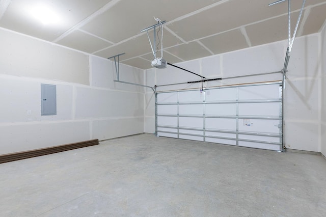 garage featuring electric panel and a garage door opener