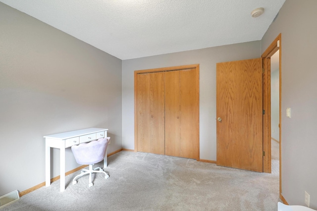 104 Craig Ln, Monticello, MN 55362 - carpeted home office with baseboards and a textured ceiling
