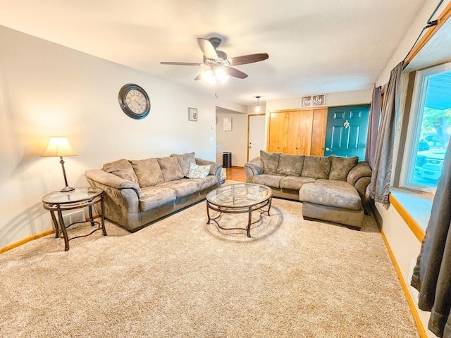 living room featuring carpet floors and ceiling fan