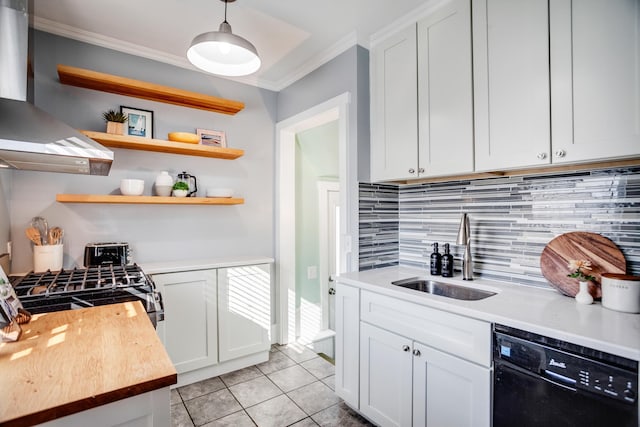 kitchen featuring light tile patterned floors, a sink, dishwasher, wall chimney exhaust hood, and crown molding