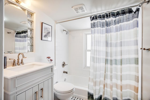 full bathroom with toilet, shower / bath combo with shower curtain, vanity, and visible vents