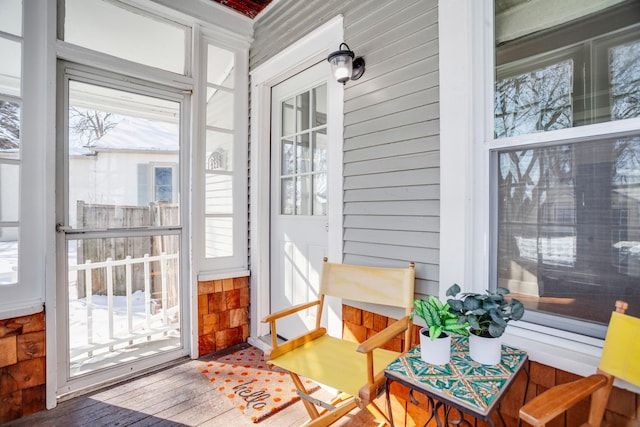 sunroom / solarium featuring a healthy amount of sunlight