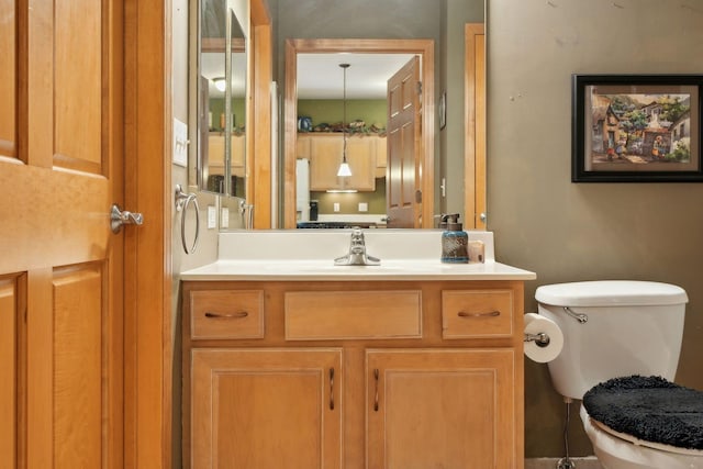 bathroom with vanity and toilet