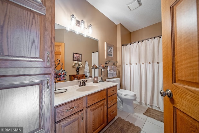 bathroom featuring tile patterned flooring, toilet, a textured ceiling, vanity, and a shower with curtain