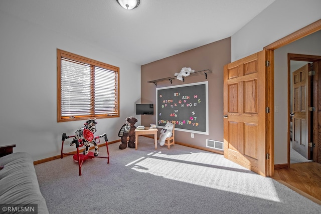 living area with light colored carpet