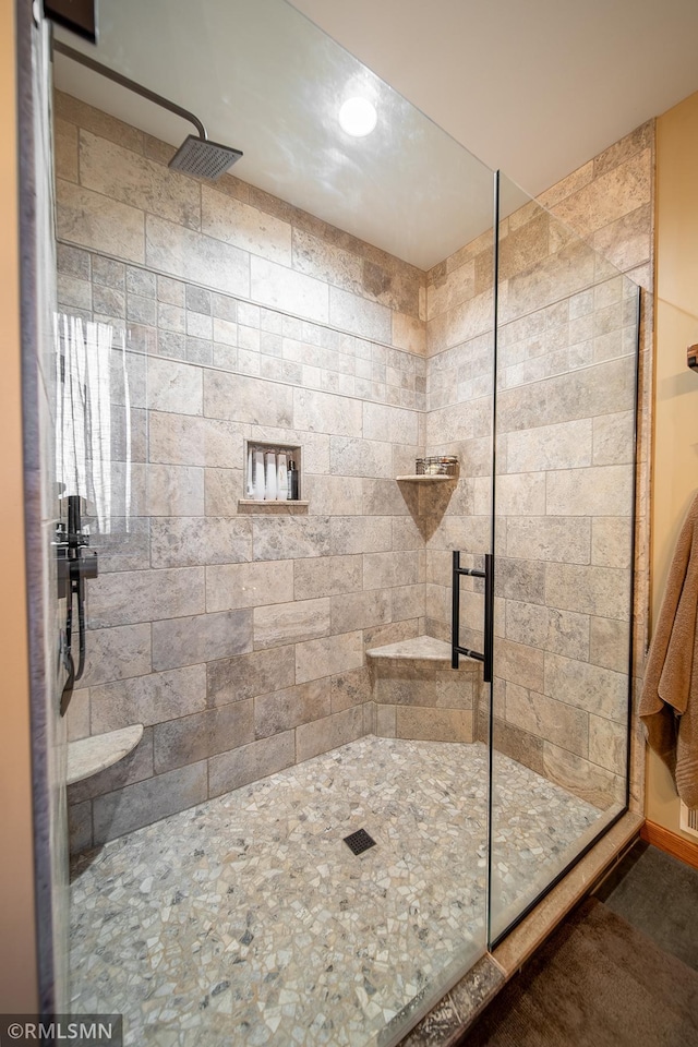 bathroom featuring walk in shower