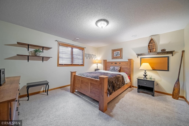 carpeted bedroom featuring a textured ceiling